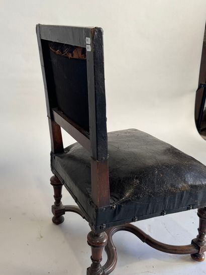 Small low chair in molded wood, black leather...