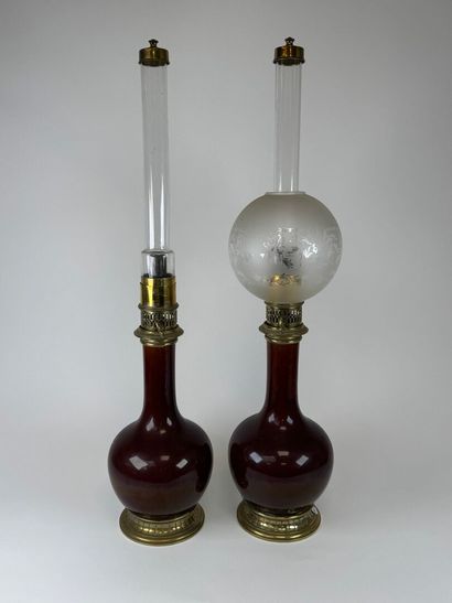 Pair of glazed ceramic kerosene lamps on...