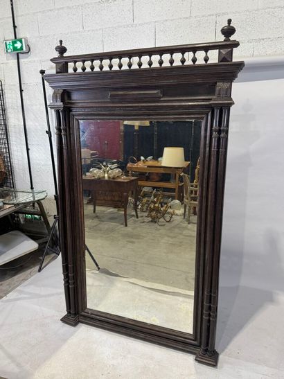 Large mirror in stained wood, the uprights...