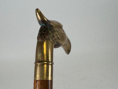 Wooden and brass system cane, the pommel...