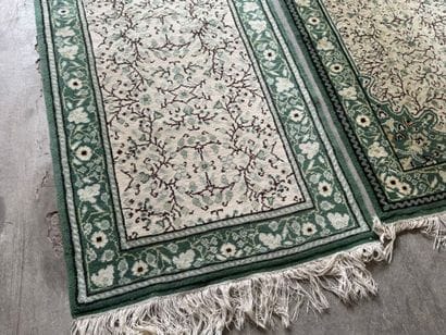 IRAN. 
Suite of three polychrome wool carpets...