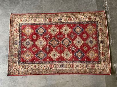 KAZAK. 
Polychrome wool carpet, the central...
