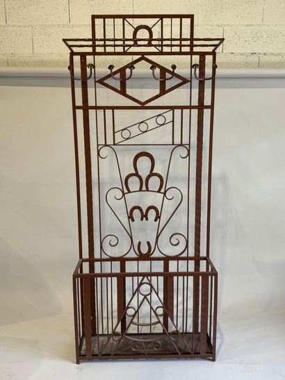 Wrought and painted iron checkroom decorated...