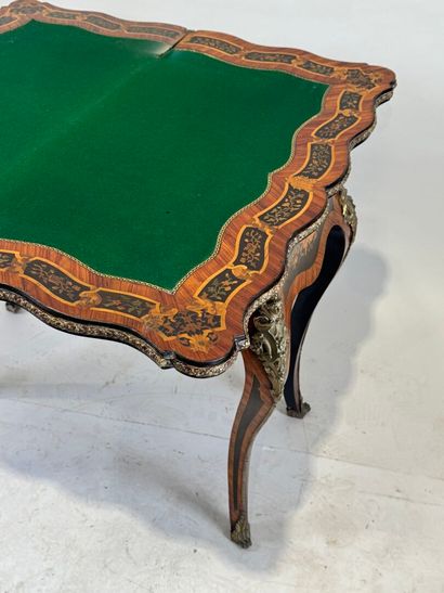 Wood and marquetry game table featuring a...