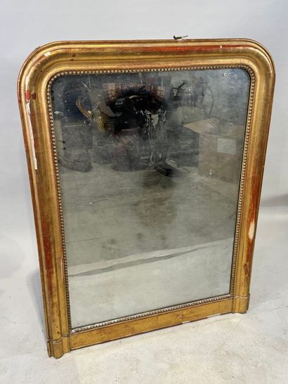 Wood and gilded stucco mirror decorated with...