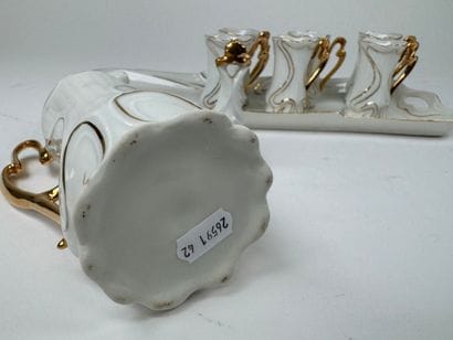 Small white and gold porcelain liqueur service...