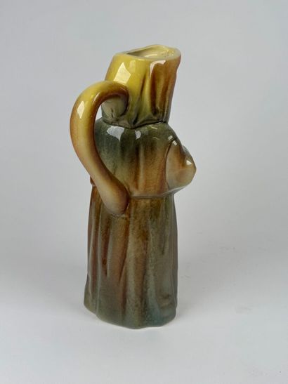 Polychrome earthenware pitcher featuring...
