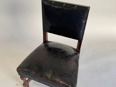 Small low chair in molded wood, black leather...
