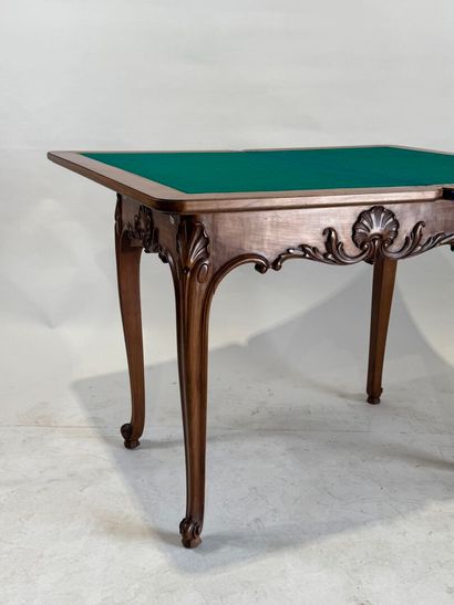 Molded and carved wood game table opening...