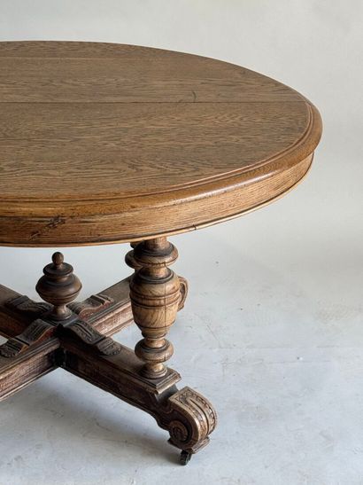 Large molded oak pedestal table on casters.
Henry...