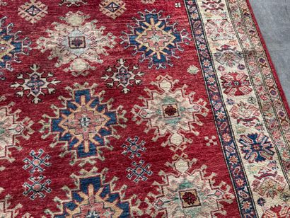 KAZAK. 
Polychrome wool carpet, the central...