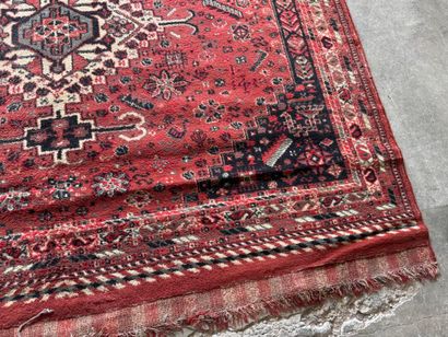 Polychrome wool carpet with stylized motifs...