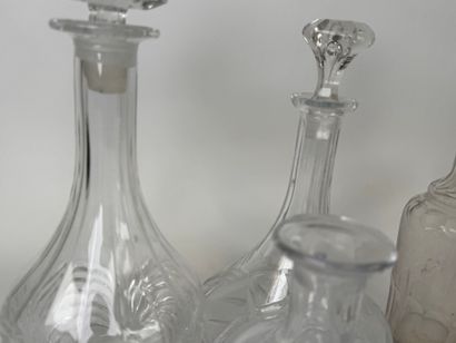 Seven glass and crystal decanters.
H. 30...