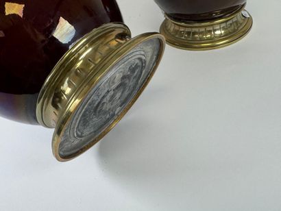 Pair of glazed ceramic kerosene lamps on...