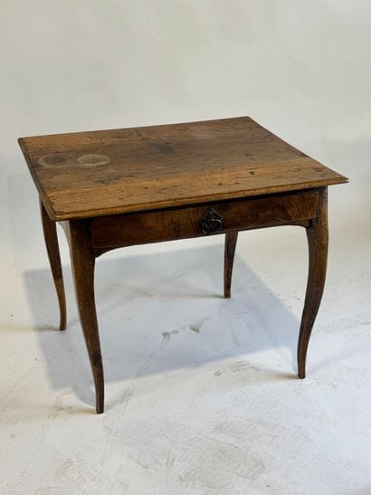 Small rustic table in molded walnut opening...