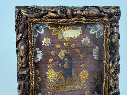 Small reliquary frame in gilded and carved...