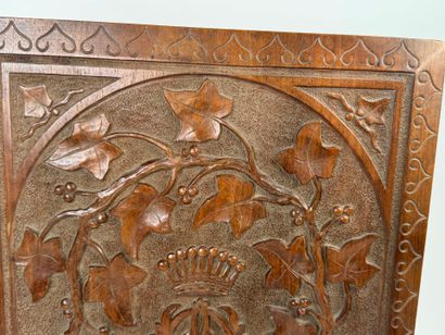 A two-plate folio in carved wood with the...