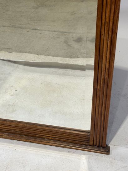 Molded and carved wood mirror with a frieze...