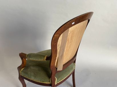 Moulded mahogany armchair with green velvet...