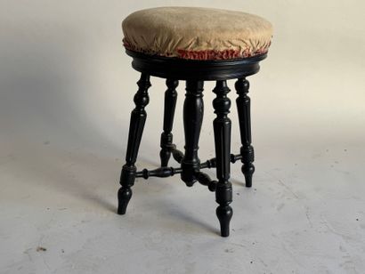 Molded, carved and blackened wood piano stool.
Napoleon...