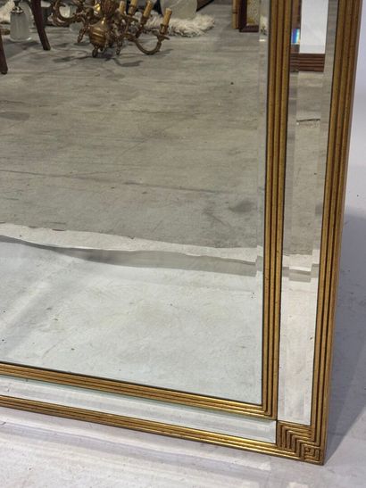 Gilded wood mirror with rounded top and beveled...