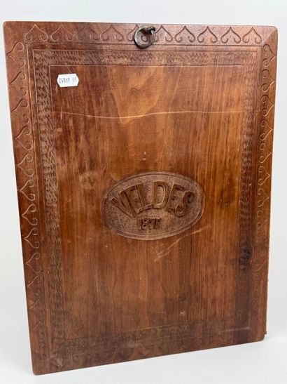 A two-plate folio in carved wood with the...