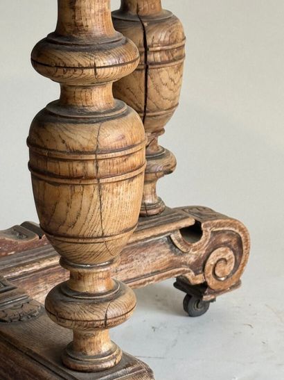 Large molded oak pedestal table on casters.
Henry...
