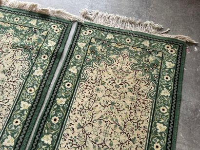 IRAN. 
Suite of three polychrome wool carpets...