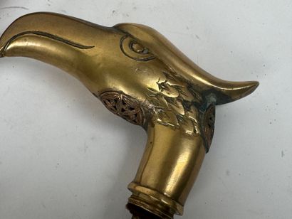 Wooden and brass system cane, the pommel...