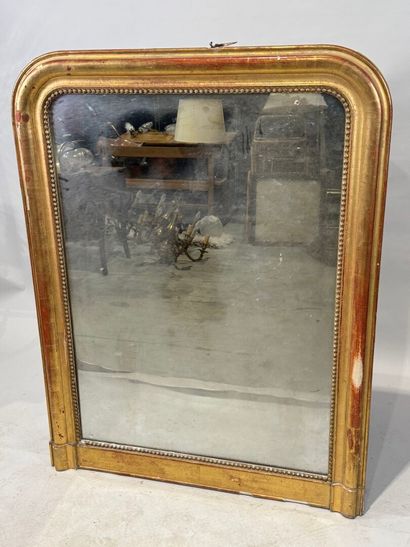 Wood and gilded stucco mirror decorated with...