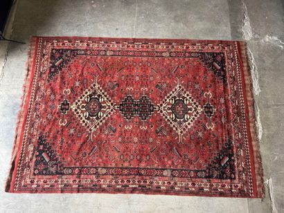Polychrome wool carpet with stylized motifs...
