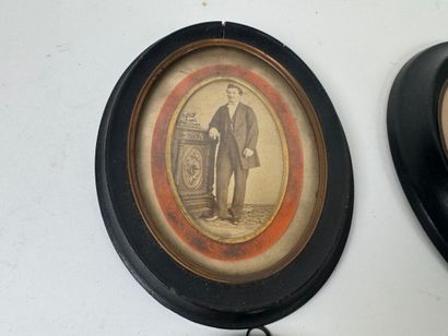 Set of four blackened wood and glass picture...