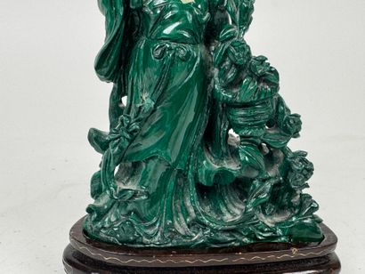 CHINA, 20th century.
Woman with flowers.
Carved...