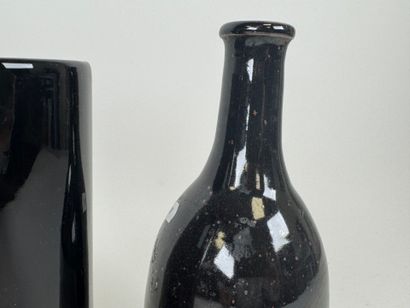 Set of two ceramic vases and a bottle with...