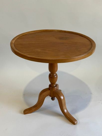 Small circular tripod pedestal table in fruitwood....