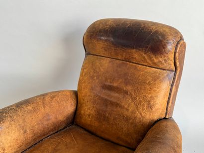 Club armchair in havana leather with arched...