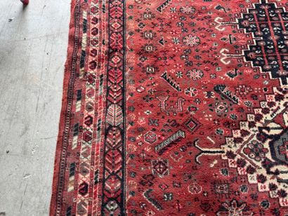 Polychrome wool carpet with stylized motifs...