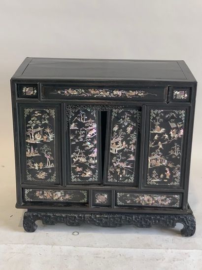 ASIA, 20th C. Low cabinet opening with two...