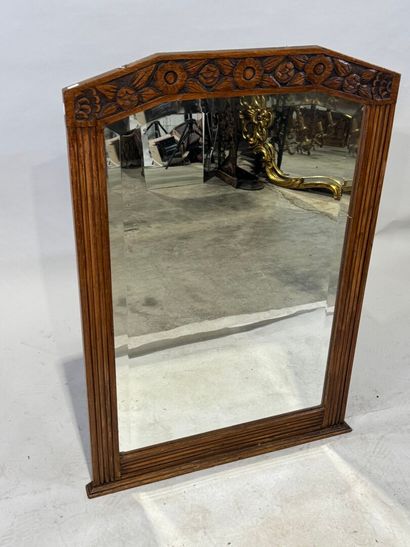 Molded and carved wood mirror with a frieze...