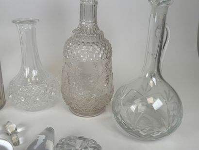 Seven glass and crystal decanters.
H. 30...