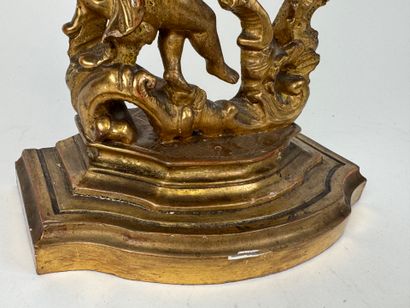 Carved and gilded wood and stucco watch-holder...