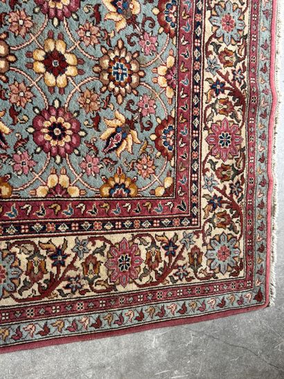 Polychrome wool carpet with floral motifs....