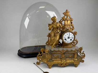 Gilded regule and alabaster clock decorated...