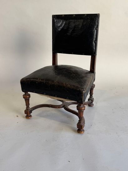 Small low chair in molded wood, black leather...