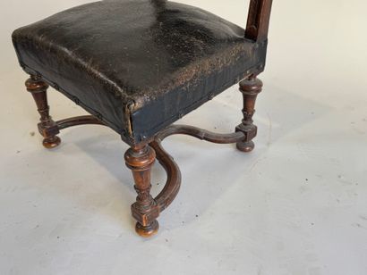 Small low chair in molded wood, black leather...