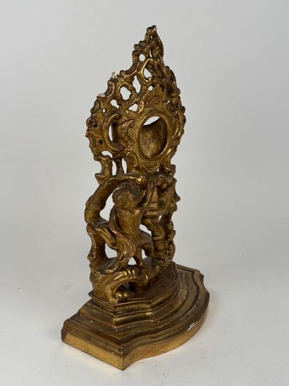 Carved and gilded wood and stucco watch-holder...