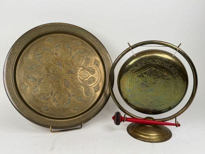Chased brass gong with painted wooden hammer....