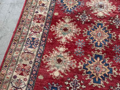 KAZAK. 
Polychrome wool carpet, the central...