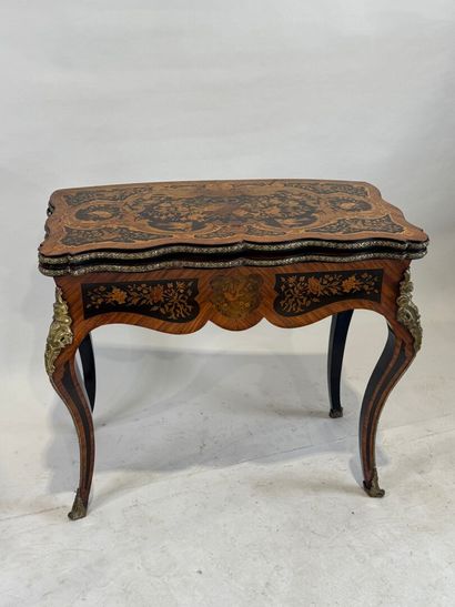 Wood and marquetry game table featuring a...