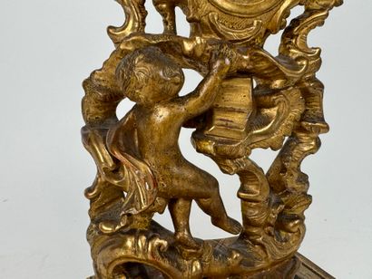 Carved and gilded wood and stucco watch-holder...